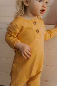 Grow-with-me yellow with pear print onesie 