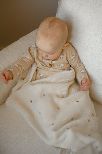 Crocheted blanket with multicolored polka dots