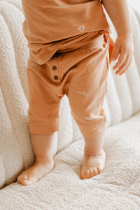 Short/capri évolutif orange brûlé avec motifs