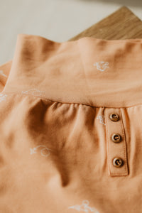 Short/capri évolutif orange brûlé avec motifs